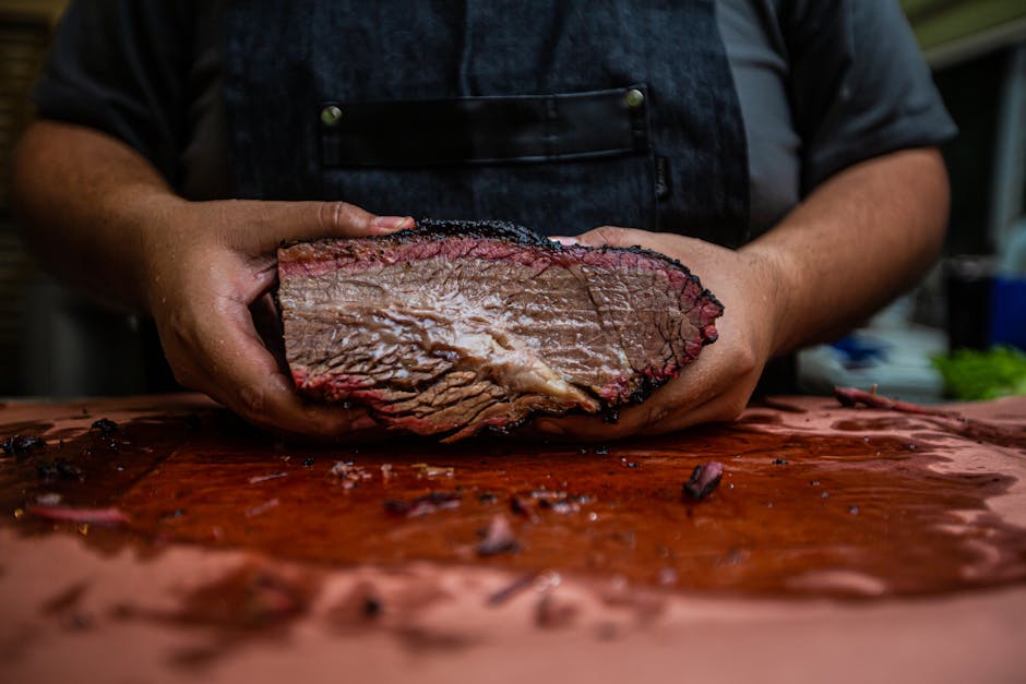 Smoked beef brisket on wooden cutting board